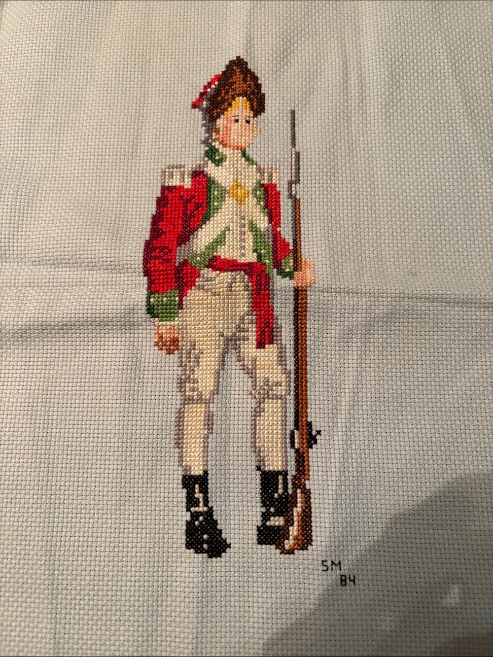 Hand-stitched Red and Green Soldier Cross-Stitch Art completed - Picture 1 of 1